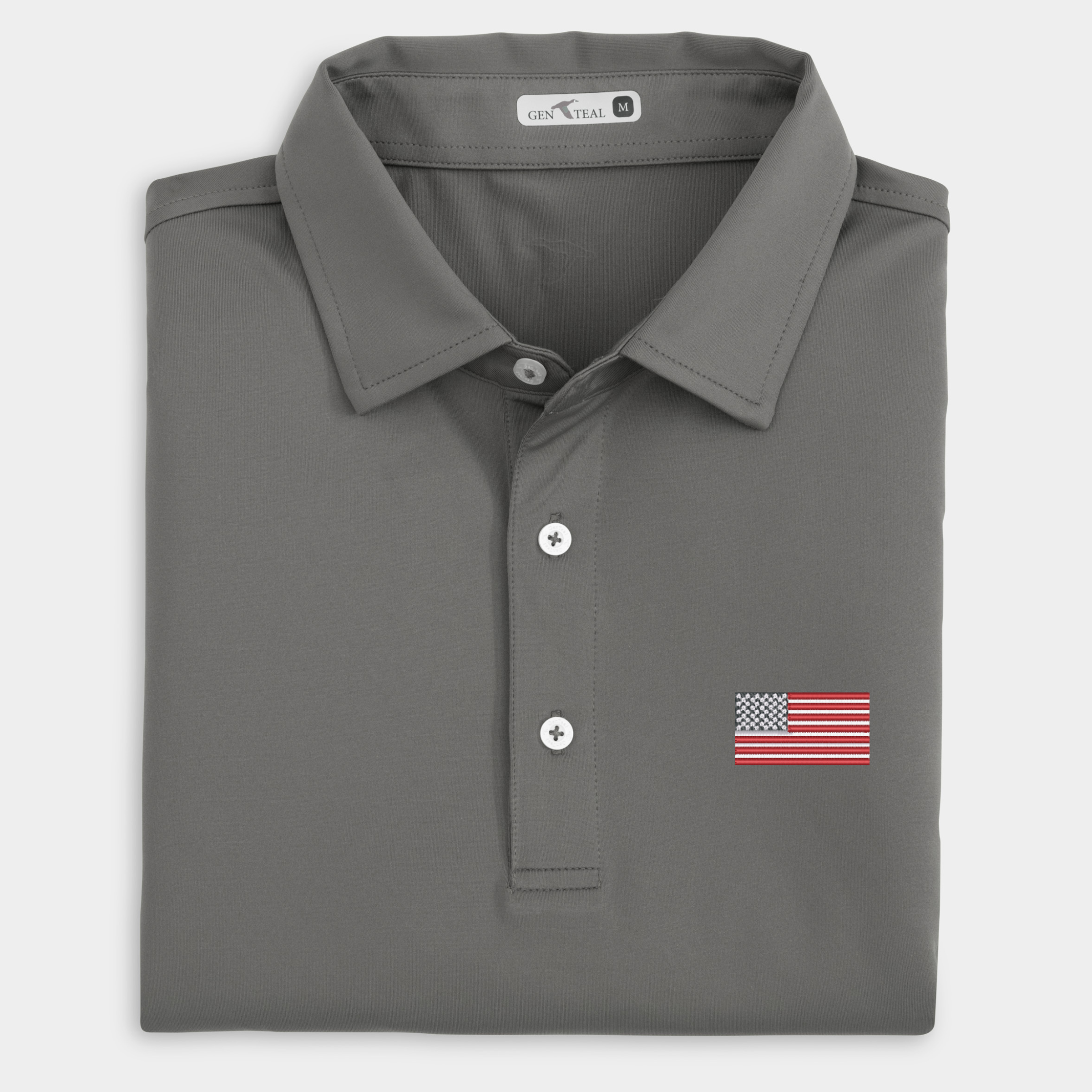 Gray polo shirt with American flag patch on a light gray background