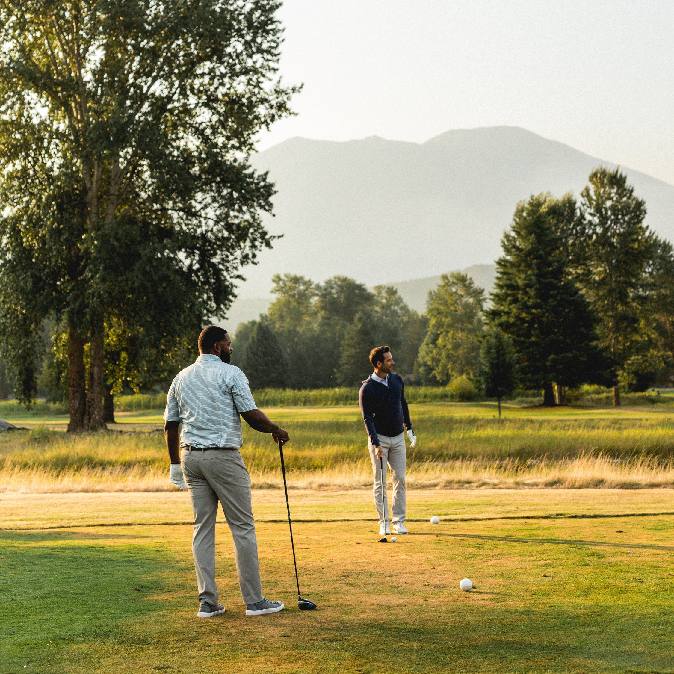 men standing on the golf green in GenTeal mens apparel